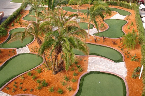 Atlanta Aerial view of a mini golf course with synthetic grass and palm trees.